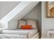Cozy window seat nestled under the eaves, furnished with plush pillows and complemented by natural light at 3 Atlantic St, Charleston, SC 29401