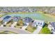 An aerial view of the neighborhood and pond showcases community living at its finest at 3016 Adventure Way, Ladson, SC 29456