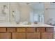 Bathroom with a dual sink vanity and a large mirror, creating an elegant space for your daily routine at 3016 Adventure Way, Ladson, SC 29456