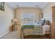 This bedroom offers natural light, a large bed, carpet, and neutral paint making it warm and cozy at 3016 Adventure Way, Ladson, SC 29456