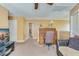 The bonus room with tan walls boasts an antique desk, and carpeted floors, offering comfort and functionality at 3016 Adventure Way, Ladson, SC 29456