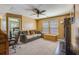 A cozy bonus room featuring a ceiling fan, sofa, desk, and an attached bedroom adds versatile living space at 3016 Adventure Way, Ladson, SC 29456