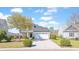 Inviting two-story home with lush landscaping, a wide driveway, and a classic suburban appeal at 3016 Adventure Way, Ladson, SC 29456