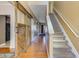 Inviting foyer featuring hardwood floors, a staircase, and a rustic sliding barn door at 3016 Adventure Way, Ladson, SC 29456