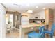Efficient kitchen featuring a breakfast bar with stool seating and a small dining table at 302 Palmetto Dr # A-302, Isle of Palms, SC 29451