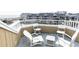Inviting rooftop deck with white wooden furniture, ideal for relaxing and enjoying outdoor living at 302 Palmetto Dr # A-302, Isle of Palms, SC 29451