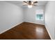 Bedroom featuring wood floors, a window, and a ceiling fan at 3048 Queensgate Way, Mount Pleasant, SC 29466