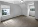 Bright bedroom features two windows, neutral carpeting, and recessed lighting for a serene and comfortable space at 3048 Queensgate Way, Mount Pleasant, SC 29466