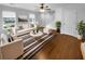 Bright living room featuring wood floors, natural light and stylish decor at 3048 Queensgate Way, Mount Pleasant, SC 29466