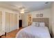 Cozy bedroom featuring a comfortable bed, ceiling fan, and closet at 338 King St # B, Charleston, SC 29401