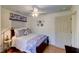Comfortable bedroom with a ceiling fan, hardwood floors and natural lighting at 338 King St # B, Charleston, SC 29401