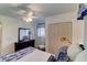 Cozy bedroom features closet, a ceiling fan, dresser, and natural light at 338 King St # B, Charleston, SC 29401