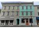 Charming multi-story building with unique architecture and vibrant colors in downtown area at 338 King St # B, Charleston, SC 29401