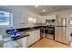 Modern kitchen with white cabinets, stainless steel appliances, and sleek countertops at 338 King St # B, Charleston, SC 29401