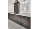 Elegant bathroom with double vanity, marble countertop, and dark wood cabinetry at 3409 Southern Cottage Way, Mount Pleasant, SC 29466