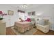 Bright bedroom features whimsical decor, white furniture, and cheerful accents at 3409 Southern Cottage Way, Mount Pleasant, SC 29466