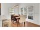 Bright dining room with natural light, a modern light fixture, and a wooden table at 3409 Southern Cottage Way, Mount Pleasant, SC 29466