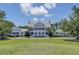 Stately white home with large columns and a manicured front lawn at 3409 Southern Cottage Way, Mount Pleasant, SC 29466