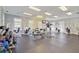 Bright fitness center with full range of exercise equipment and natural light from surrounding windows at 3409 Southern Cottage Way, Mount Pleasant, SC 29466