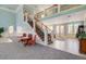Grand foyer with staircase, high ceilings, and elegant decor at 3409 Southern Cottage Way, Mount Pleasant, SC 29466