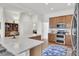 Open kitchen with stainless steel appliances, island seating, and a seamless design at 3409 Southern Cottage Way, Mount Pleasant, SC 29466