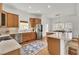 Spacious kitchen features stainless steel appliances, wooden cabinets, and an island with seating at 3409 Southern Cottage Way, Mount Pleasant, SC 29466