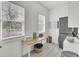 Functional laundry room with washer, dryer, folding table, and natural light at 3409 Southern Cottage Way, Mount Pleasant, SC 29466