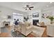 Inviting living room features a fireplace, built-in shelves, and comfortable furnishings at 3409 Southern Cottage Way, Mount Pleasant, SC 29466