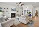 Cozy living room with a fireplace, TV, and ample seating for entertaining at 3409 Southern Cottage Way, Mount Pleasant, SC 29466