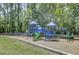 Colorful playground with slides, swings, and climbing features, all surrounded by a secure fence at 3409 Southern Cottage Way, Mount Pleasant, SC 29466