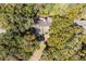 Birds-eye of a home's roof, landscaping, and privacy within a community full of trees at 3475 Deer Run Rd, Seabrook Island, SC 29455