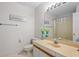 Bright bathroom featuring a large mirror, vanity, neutral color scheme, and coordinated decor at 3475 Deer Run Rd, Seabrook Island, SC 29455