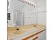 A bathroom with a double sink and a large mirror at 3475 Deer Run Rd, Seabrook Island, SC 29455