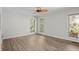 An empty bedroom with wood floor and two windows bringing in light at 3475 Deer Run Rd, Seabrook Island, SC 29455