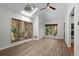 Bright bonus room with skylight, hardwood floors, and multiple windows at 3475 Deer Run Rd, Seabrook Island, SC 29455