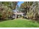 Attractive single-story home with mature landscaping and a lush green lawn at 3475 Deer Run Rd, Seabrook Island, SC 29455