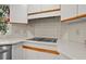 Corner of kitchen showing cooktop, backsplash, and countertop at 3475 Deer Run Rd, Seabrook Island, SC 29455
