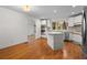 Bright kitchen with an island, stainless steel appliances, and hardwood floors at 3475 Deer Run Rd, Seabrook Island, SC 29455
