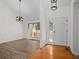 Bright living room featuring lovely light fixtures, wood flooring, and natural light at 3475 Deer Run Rd, Seabrook Island, SC 29455