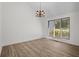 Spacious room with wood flooring and large window allowing natural light to pour in at 3475 Deer Run Rd, Seabrook Island, SC 29455