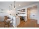 Stylish bar area with marble countertops, shelving, and barstool seating at 3803 Palm Blvd, Isle of Palms, SC 29451