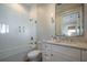 Bathroom with marble vanity, shower with glass door, and updated fixtures at 3803 Palm Blvd, Isle of Palms, SC 29451
