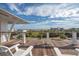 Deck with lounge chairs overlooking a scenic view of beach and neighborhood at 3803 Palm Blvd, Isle of Palms, SC 29451