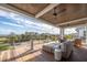 Inviting outdoor deck features plush seating and ceiling fan for ultimate relaxation and comfort at 3803 Palm Blvd, Isle of Palms, SC 29451