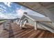 Rooftop deck with several white Adirondack chairs showcases the home's amazing views at 3803 Palm Blvd, Isle of Palms, SC 29451