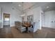 Formal dining room with seating for ten, featuring a decorative chandelier and artwork at 3803 Palm Blvd, Isle of Palms, SC 29451