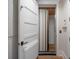 Hallway view of a home elevator with folding doors at 3803 Palm Blvd, Isle of Palms, SC 29451