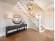 Elegant entryway with staircase, wood floors, and stylish decor at 3803 Palm Blvd, Isle of Palms, SC 29451