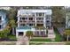 Beautiful home featuring a large pool area, multi-story balconies, and lush landscaping at 3803 Palm Blvd, Isle of Palms, SC 29451