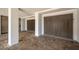 Well-lit covered parking area with tiled flooring and decorative doors at 3803 Palm Blvd, Isle of Palms, SC 29451
